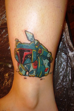 fuckyeahtattoos:  This is my 4th tattoo! It’s a “BulbaFett”, a mix of Bulbasaur from Pokémon and Boba-Fett from Star Wars.BulbaFett is a creation of Jonah Block , an excellent graphic artist and I fell in love with this illustration . My boyfriend, Cleber