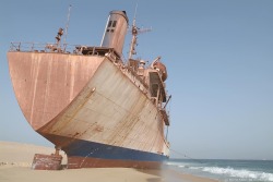 abandonedporn:  Stranded ship on a Mauritanian beach. Also known as a ship cemetery.  Stranded ships like this make me want to explore them more than any other man-made structure i think. In a mad-max-ish fantasy world i would totally fortify a ship like