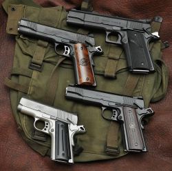 gunrunnerhell:  1911’s… (4 well made 1911 handguns; ranging from Kimber to Wilson Combat to LAR. This is a good example at how massive the LAR Grizzly is in comparison to it’s relatives. The one pictured is chambered in 44 Magnum, which is pretty