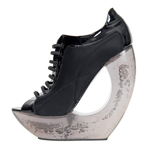 heelchorus:» Paule Ka black peep toe sneaker(?) on bubbly architectural Lucite platform wedge heel. 