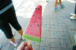 p0sterchild:  i love this picture because not only does the popsicle look delicious but the unfocused shoes in the background are really colorful too 