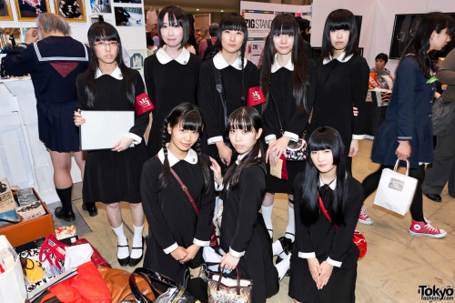 A bunch of Japanese girls in uniform at Design Festa in Tokyo. Also check out the school girl on the