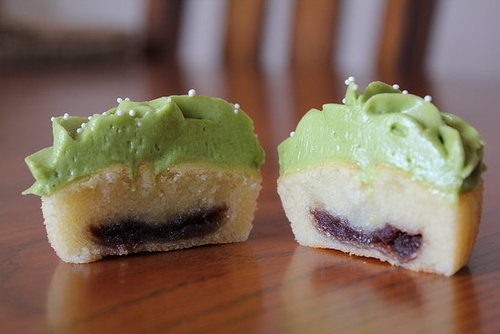 ourinterwebs:Red Bean-Filled Mochi Cupcakes with Green Tea Frosting.