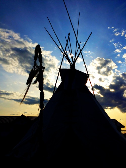 Oglala Lakota College students learning how to set up a Tipi in their Lakota Culture class.