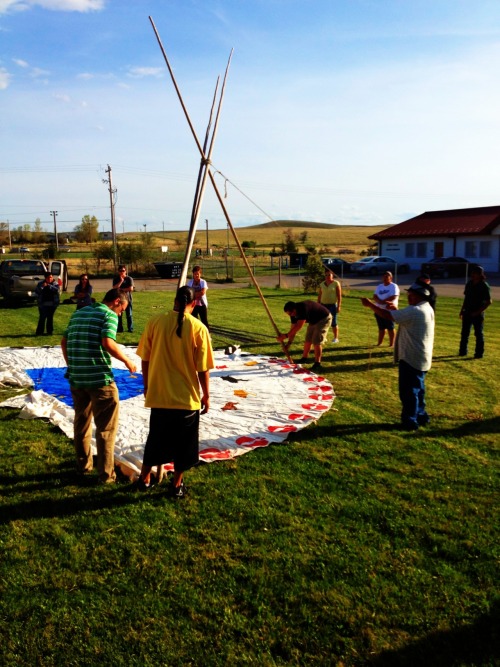 Oglala Lakota College students learning how to set up a Tipi in their Lakota Culture class.