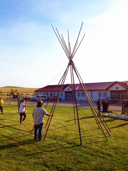 Oglala Lakota College students learning how to set up a Tipi in their Lakota Culture class.