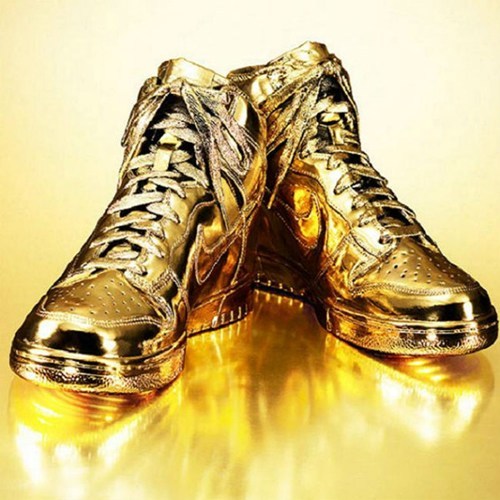 thedailywhat:  Fancy Footwear of the Day: You might actually have to be Michael Jordan to afford “Indulgences #5,” a pair of authentic Nike dunks dipped in 24-karat gold (and apparently a real, actual thing that exists). The swanky shoes, designed