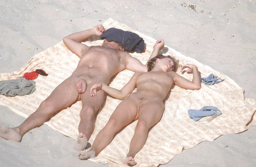 XXX nudistlifestyle:  Nudist couple sunbathing photo