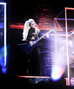 Gaga playing the guitar during “Electric