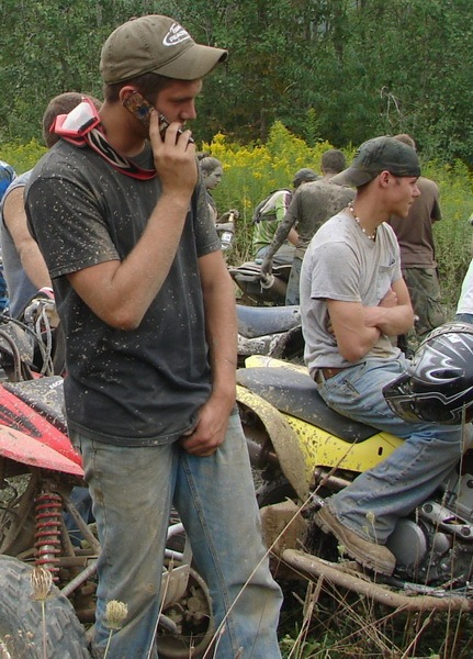 Dude adjusting his boner, after riding his ATV.