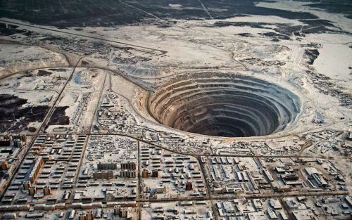     Mir diamond mine in Russia. The mine Diameter is 1,200 meters and it has a depth of 525 metres. 