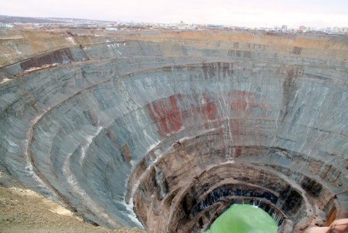     Mir diamond mine in Russia. The mine Diameter is 1,200 meters and it has a depth of 525 metres. 