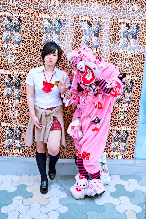 Gloomy Bear x Japanese schoolgirl in front of leopard-print Hello Kitty window display at LaForet Ha