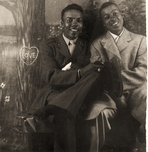 A vintage photo of two Black gay men in love.
