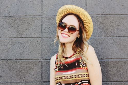 Emma of A Beautiful Mess in a pair of vintage-inspired sunnies.