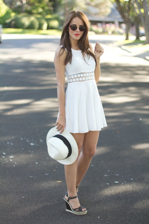 teenvogue:  Fashion Click blogger Julia Engel of Gal Meets Glam keeps it cool with a crisp white cutout dress by Free People. Learn more about her girly ensemble here »