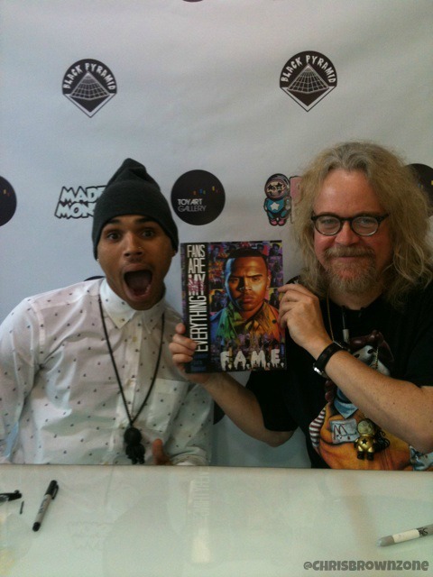 officialchrisbrownblog:  Chris Making A Funny Face With Ron English At Their Toy
