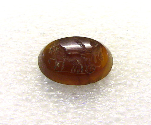 gunhilde:Amber was also a very popular material for Roman jewelry. This amber intaglio depicts two h