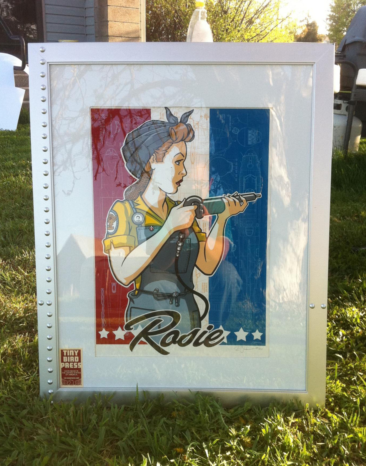 One of my collectors sent me a photo of my Rosie the Riveter print he bought, all framed up. I love the rivet treatment on the frame. Looks GORGEOUS!