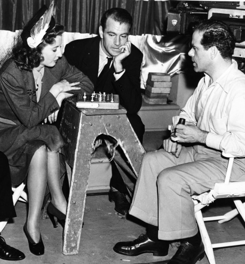 signorelli-girl: Barbara Stanwyck and Frank Capra playing chess on the set of Meet John Doe (1941) w