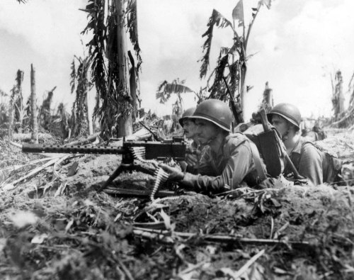 US Marines Gunnery Sergeant J. Paget and Privates L. C. Whether and V. A. Sot with their Browning M1