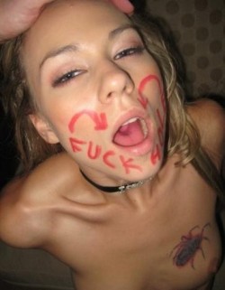 The writing on her face , and look of degrading