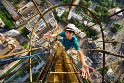 thedailyfeed:  Please don’t try this at home! Russian teenagers have embraced “skywalking,” a dangerous fad involving climbing skyscrapers, electrical towers and monuments to take breathtaking photos of the view below.  