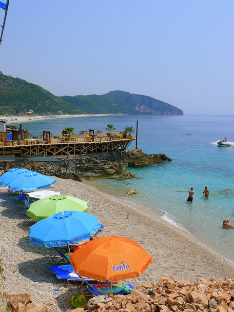 Colorful umbrellas on the beach in Dhermi, Albania (by BlendiSalaj).