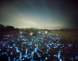 anditslove:  Photographer Lee Eunyeol constructs elaborate light installations that appear as if the night sky was flipped upside down onto the ground, creating beautiful glowing landscapes. The various colored lights resting on the earth’s cracks