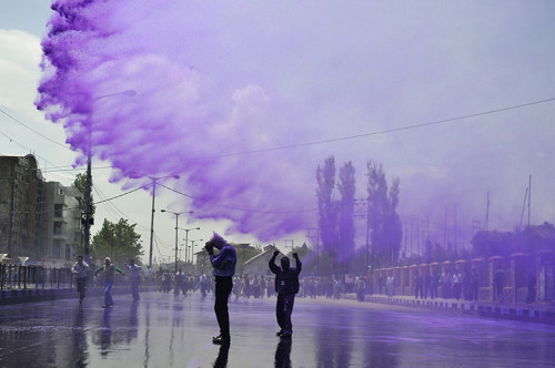 politics-war:  Kashmiri government employees are sprayed with purple coloured water by Indian police