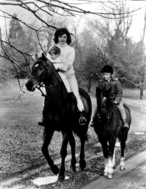 First Moms
First Lady Jacqueline Kennedy and her children John F. Kennedy Jr. and Caroline Kennedy riding, 11/19/62.
-from the Kennedy Library