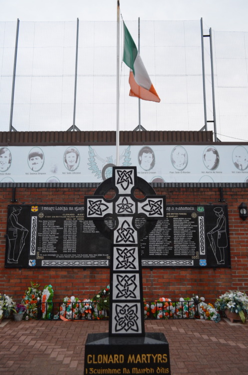 The Clonard Martyr’s Memorial.  Behind it, green ‘peace walls’ separate Catholic a