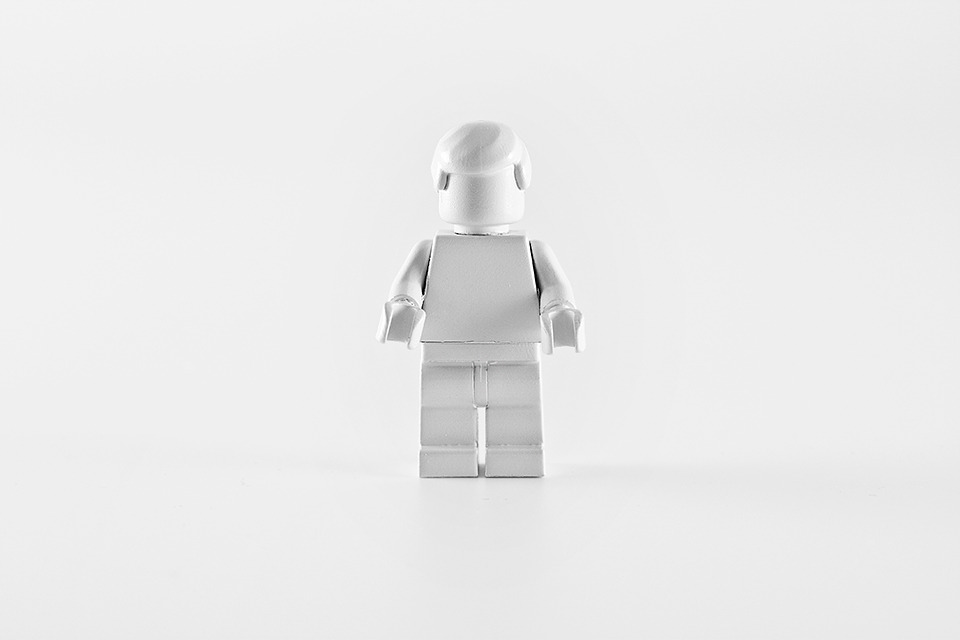 Brand Spirit - branded objects painted in white, removing all visual branding, reducing the object to its purest form - Lego Man.