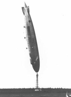 nucleargearing:  Lakehurst, NJ The Airship Los Angeles is blown by a gust of wind while tethered causing it to be in it’s upright position. “Well Captain, It looks like you’ve gotten that glass bottom gondola you’ve always wanted!” 