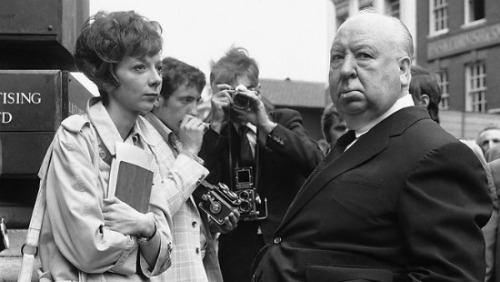 Pictured above: Sir Alfred Hitchcock, mastering the art of the inward eyeroll while Ms. Anne Helm bu