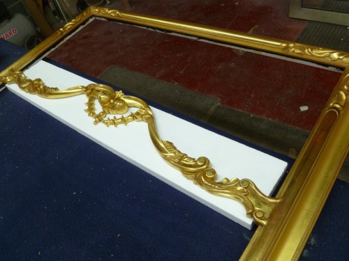 This is a customized version of C&J Frame number C718. The size is 45x99 and it will be used for a mirror. The frame is hand carved and finished in 22k gold.