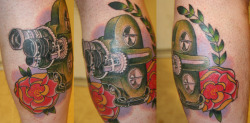 fuckyeahtattoos:  Got this tattoo on my calf because i am a film student and love cameras. This happened to be the first “movie” camera i shot film in. The Bell and Howell Filmo-70DA camera. A mix between photo-realism and traditional. Tattooed by