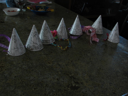 diyaday:  Party time! I modified these party hats with a few simple decorations, like some rhinestones for Rarity, a large pink bow for Pinky Pie, a (not pictured) purple feather for Spike… They can easily be attached by using a hole puncher on the