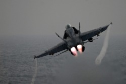 huggyisdench:  Fighter jet taking flight over seas.