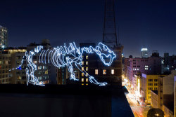 staceythinx:  Dinosaurs are back on the prowl in Darius Twin’s amazing light paintings. 