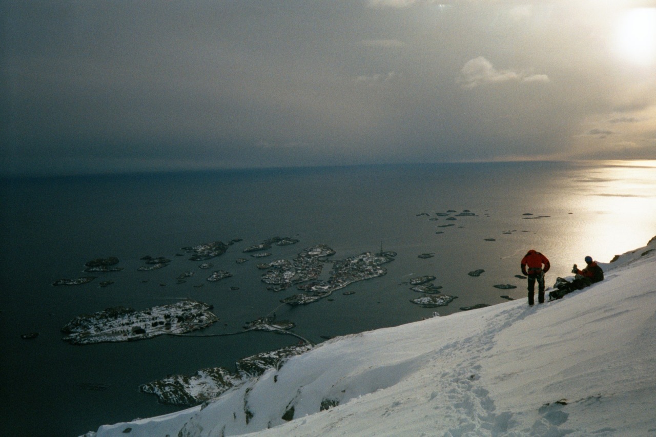 Enjoying the Climb. The village below is Hennigsvaer (Lofoten)