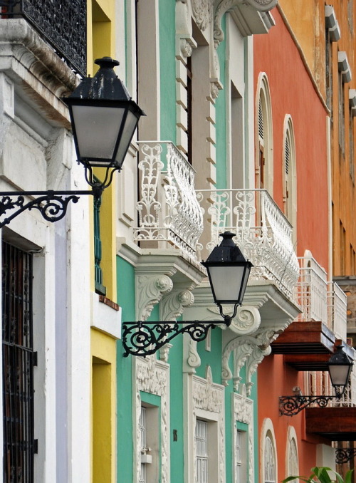 Lamps and balconies on brightly colored buildings, San Juan, Puerto Rico (by StGrundy).