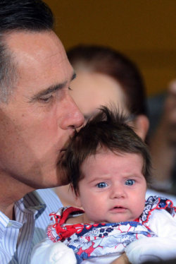 theyellowbrickroad:  republicanidiots:  Here’s Mitt sucking the life essence from a human child.  look how mortified that baby looks 