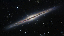 NGC 891 (also known as Caldwell 23) is an edge-on unbarred spiral galaxy about 30 million light-years away in the constellation Andromeda. It was discovered by William Herschel on October 6 1784. The galaxy is a member of the NGC 1023 group of galaxies