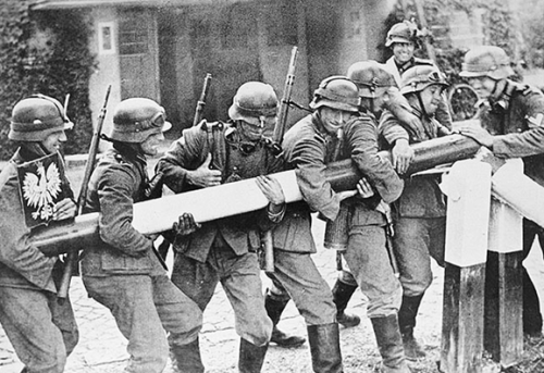 This photograph shows German troops forcibly opening the bar at the Polish border crossing in Sopot,