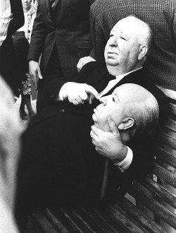 vintagesonia:  Alfred Hitchcock holding a replica dummy head. The dummy head was used in the 1972 film, Frenzy trailer for the body of Hitchcock floating down the River Thames. 