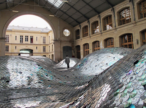 accidentalism:  created by french artist elise morin and architect clémence eliard, ‘wastelandscape’ is an undulating landscape composed of 65,000 old CDs, sorted and hand-sewn together into a 500-square meter surface. 