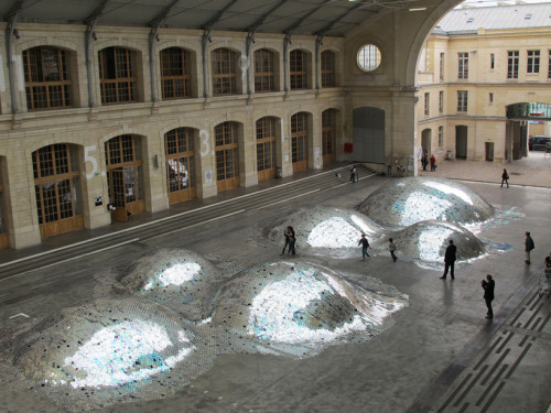 accidentalism:  created by french artist elise morin and architect clémence eliard, ‘wastelandscape’ is an undulating landscape composed of 65,000 old CDs, sorted and hand-sewn together into a 500-square meter surface. 