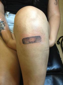 fuckyeahtattoos:  a simple bandaid on me knee to symbolize my strength over the years… and my randomness. i got it done by manny at artery tattoo and body piercing in palm city, florida. he does amazing work. http://cryandcurse.tumblr.com