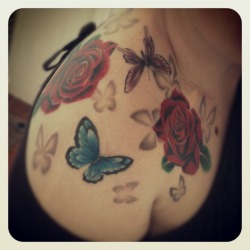 fuckyeahtattoos:  Instagram photo. No real story to this I just have a love for realistic rose tattoos and butterflies. Done by the very talented and very lovely Gareth Thomas at Skin Scene in Jersey, Channel Islands. I’m so in love with it and I still